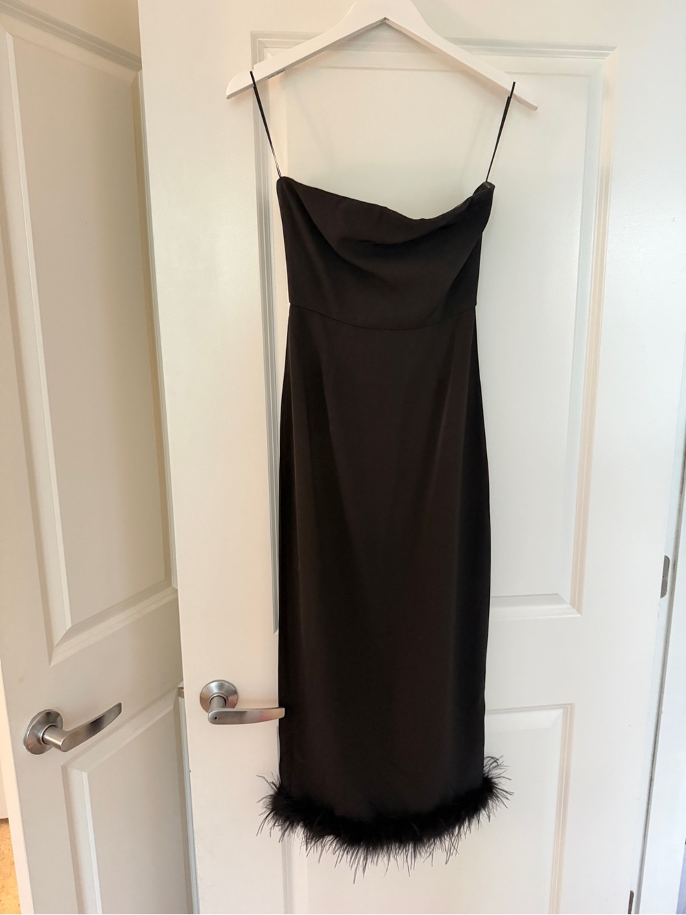 Elegant Black Slip Dress with Feather Hem